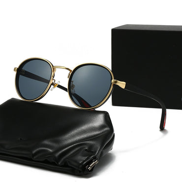 Vintage designer outdoor sunglasses displayed with a black case and gift box, combining retro style and modern comfort.