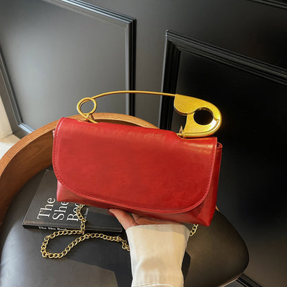 Luxury PU Leather Chain Shoulder Bag for Women in red with a unique gold handle, perfect for stylish outings and events.