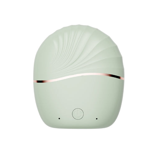 Mini Portable Hair Straightener in a stylish shell shape with a soft green finish and rose gold accent.