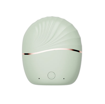Mini Portable Hair Straightener in a stylish shell shape with a soft green finish and rose gold accent.
