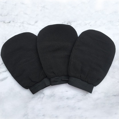 Scrub Exfoliating Gloves for Deep Cleansing & Smooth Skin, three pairs of black exfoliating mitts on marble background.