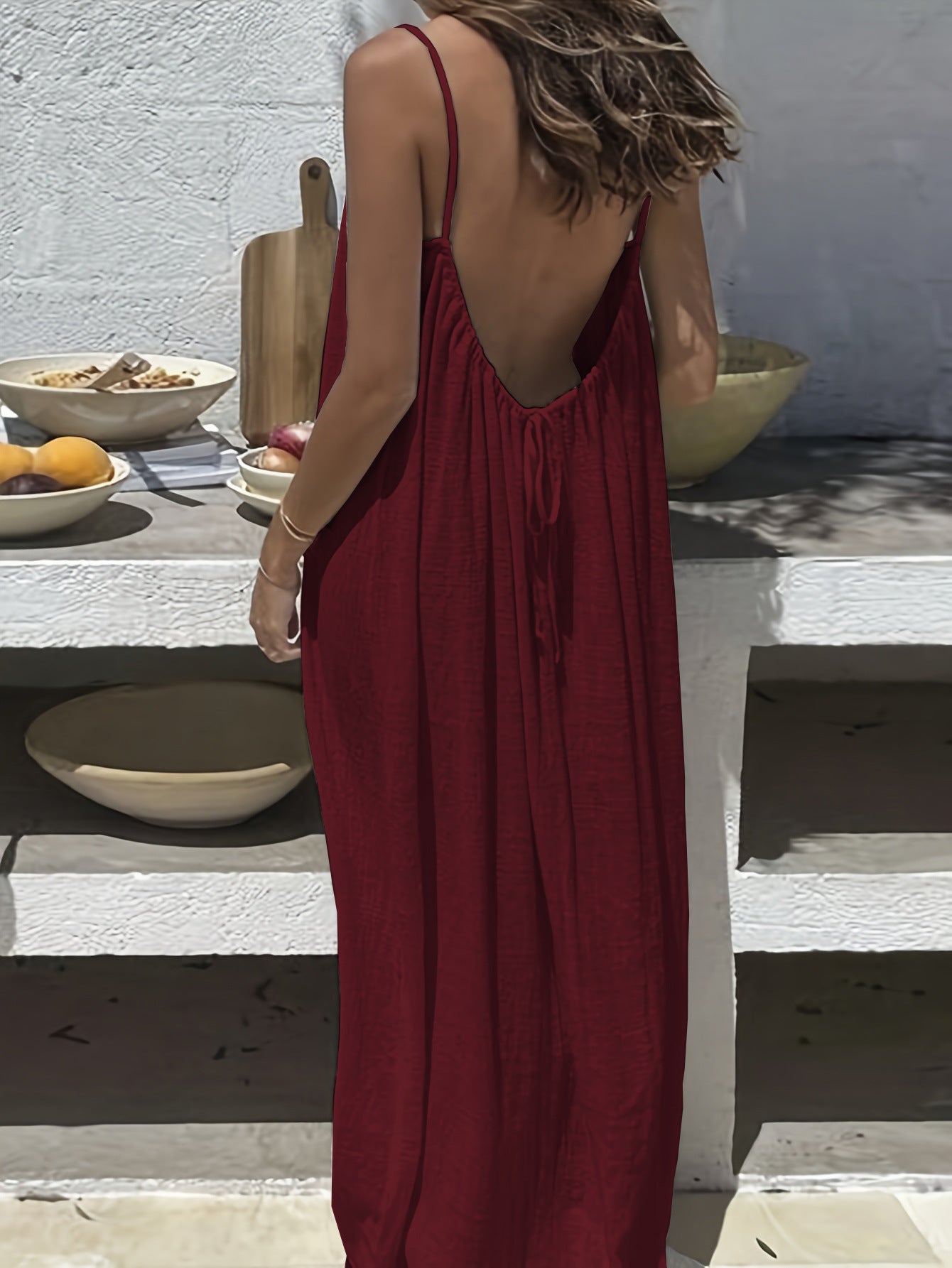 Elegant Backless Maxi Evening Dress in deep red, showcasing a backless design and flowing silhouette, perfect for elegant occasions.