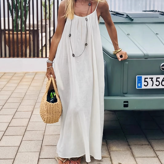 Elegant Backless Maxi Evening Dress worn outdoors with a stylish straw bag, showcasing an elegant summer look.