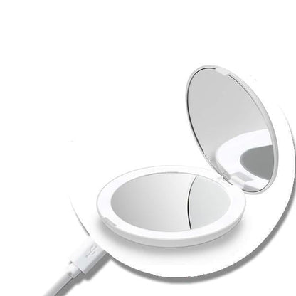 Rechargeable LED Handheld Makeup Mirror opened, showcasing its sleek design and reflective surface.