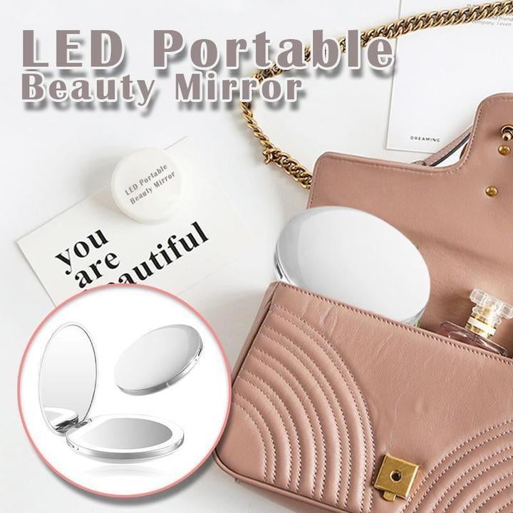 Rechargeable LED Handheld Makeup Mirror placed in a stylish handbag with beauty essentials.