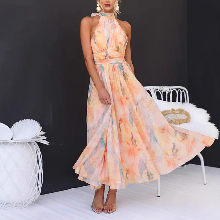Elegant Flower Print Sleeveless Dress featured in a flowing design with soft pastel colors, perfect for formal occasions.