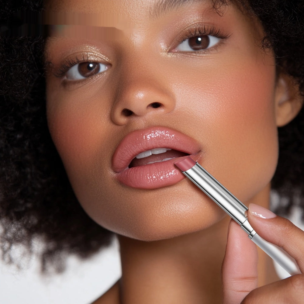 Woman applying Hyaluronic Acid Lip Plumper for Soft Fuller Lips, showcasing vivid, smooth lips and makeup artistry.