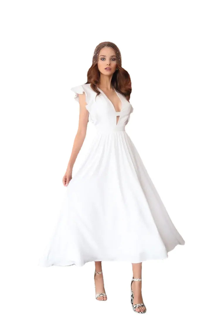 Model wearing the GraceFlow White Elegant Midi Dress, showcasing its stylish design and flowy silhouette.