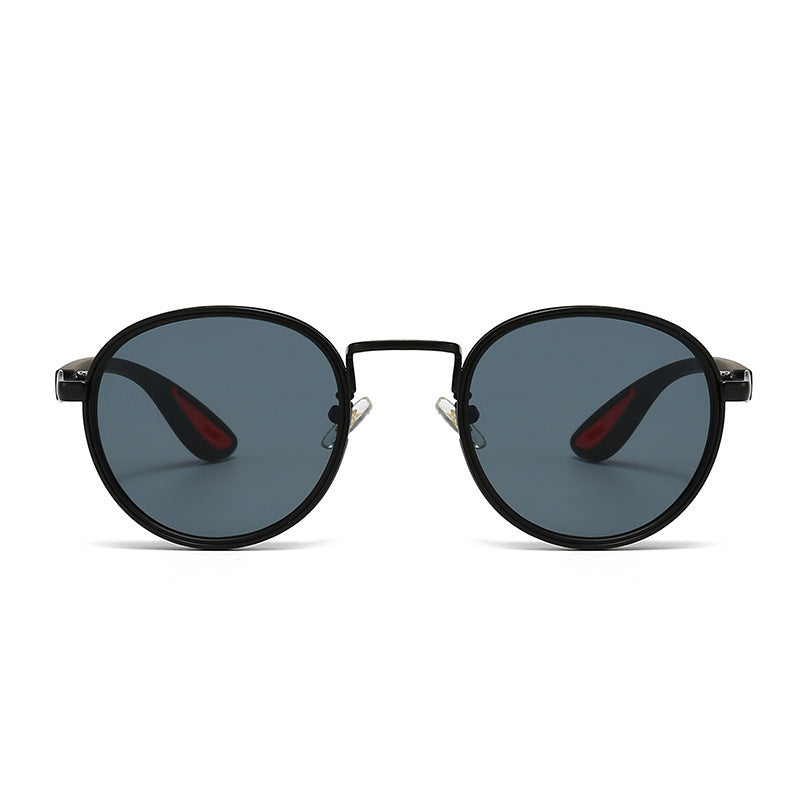 Vintage designer outdoor sunglasses with black frame and tinted lenses.