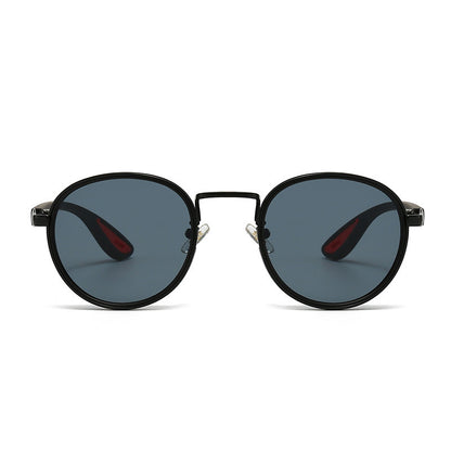 Vintage designer outdoor sunglasses with black frame and tinted lenses.
