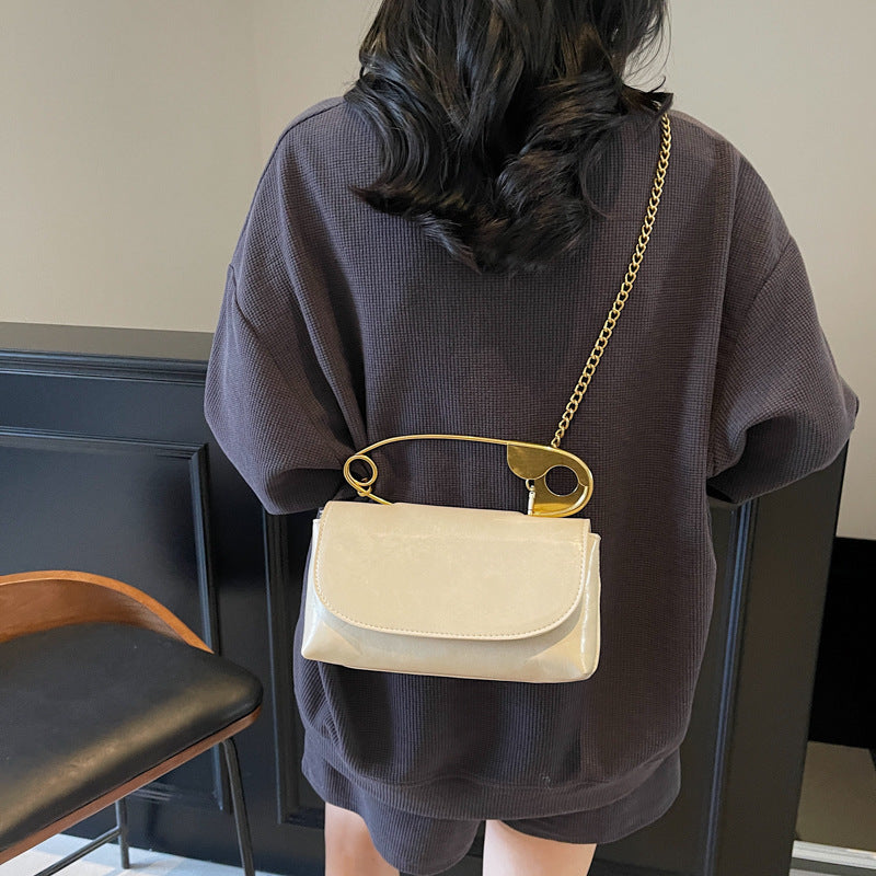 Luxury PU Leather Chain Shoulder Bag for Women showcased on a model wearing a casual outfit, highlighting its stylish design.