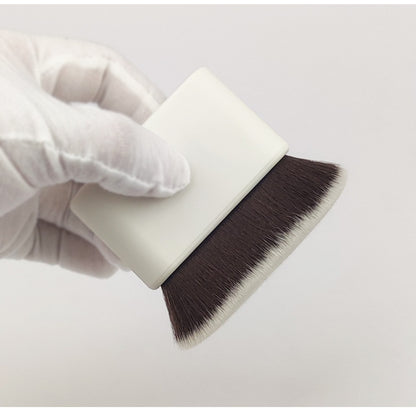 Magic Makeup Brush for Flawless Foundation & Smooth Blend held in a gloved hand, showcasing its soft bristles and ergonomic design.