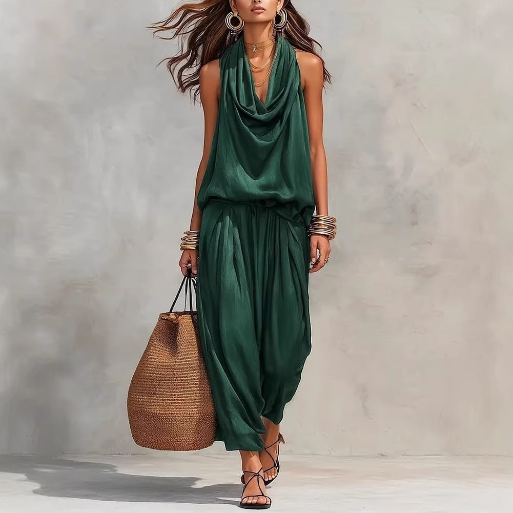 A stylish woman wearing the Simona Two-Piece Top & Pants Set with a large straw bag, perfect for casual outings.