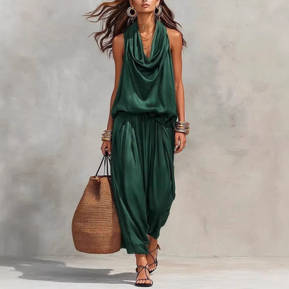 A stylish woman wearing the Simona Two-Piece Top & Pants Set with a large straw bag, perfect for casual outings.