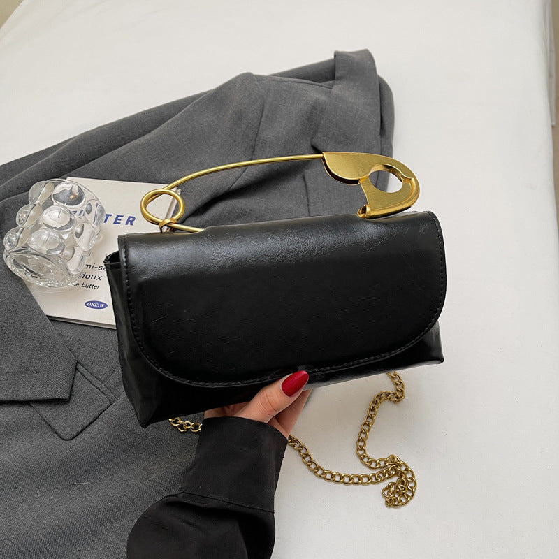 Luxury PU Leather Chain Shoulder Bag for Women with stylish gold handle and chain strap on a gray background.
