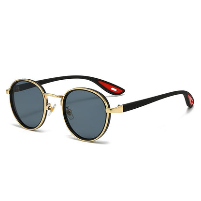 Vintage designer outdoor sunglasses featuring round dark lenses and stylish gold frame.
