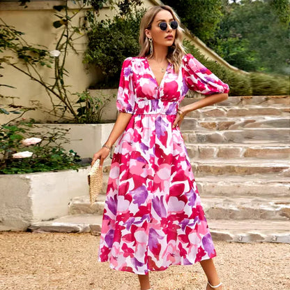 Summer V-Neck Printed Maxi Dress displayed outdoors, featuring floral patterns and elegant design.