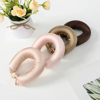 Heatless Hair Curler Curling Rod Headband in various colors displayed alongside flowers.