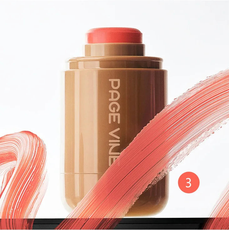 3-in-1 Cheek Lip Tinted Moistured Blush in a cream stick format with a soft pink hue and artistic brush strokes.