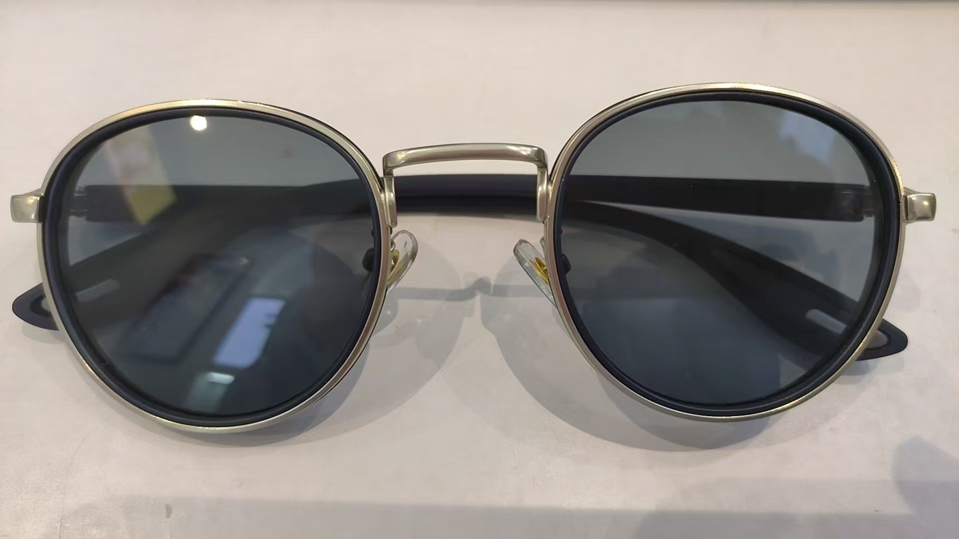 Vintage designer outdoor sunglasses featuring a round frame and dark lenses, perfect for stylish outdoor wear.
