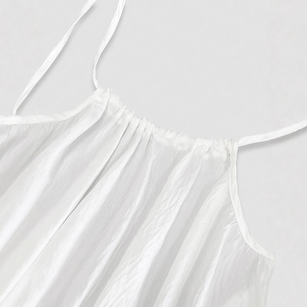 Elegant Backless Maxi Evening Dress close-up of white fabric and straps for a stylish look