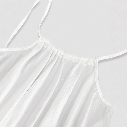 Elegant Backless Maxi Evening Dress close-up of white fabric and straps for a stylish look