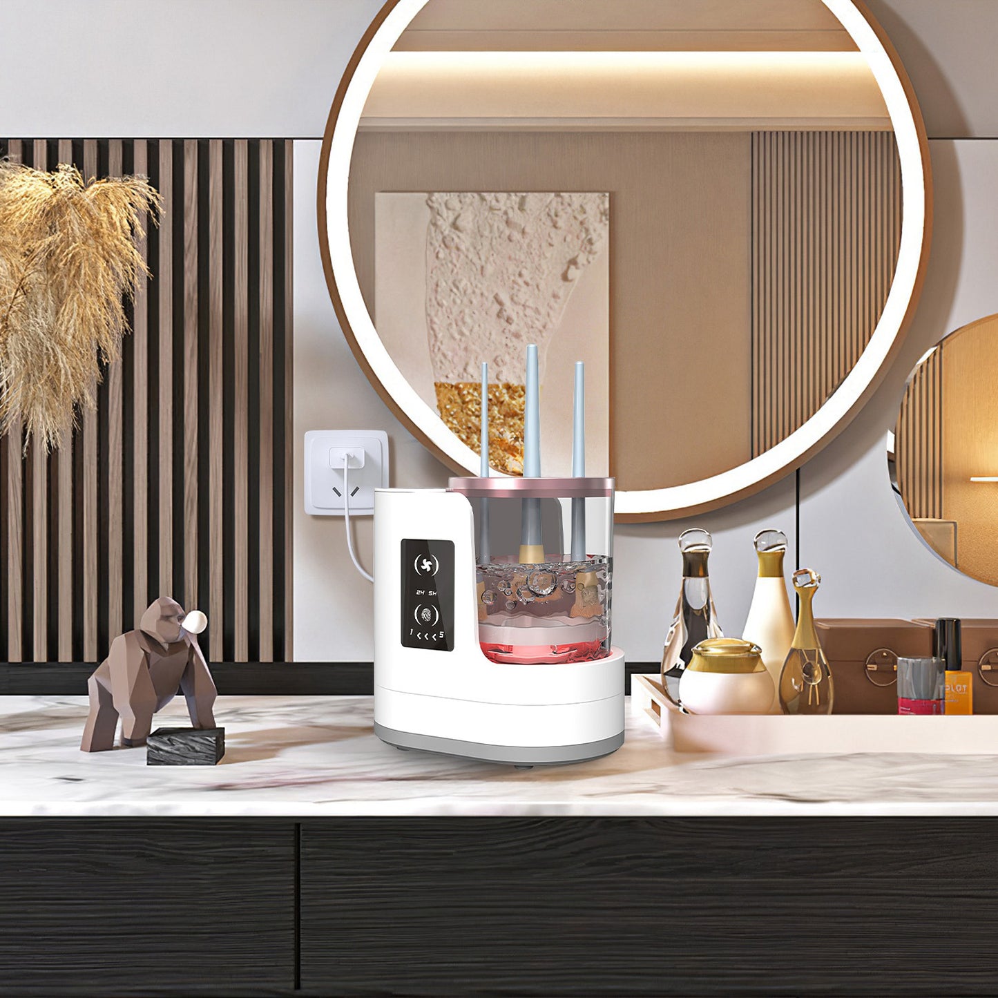 4 In 1 Electric Makeup Brush Cleaner on a stylish countertop with a mirror and decorative items.