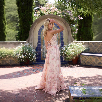 Vera Elegant Dress for Stylish Party & Casual Wear on a model in a garden setting with floral accents.